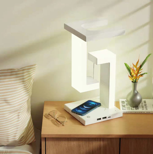 Levitate levitating balance lamp charging a phone on its wireless base