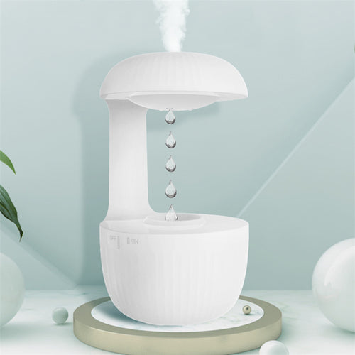 Drift anti-gravity water drop humidifier on a table with mist